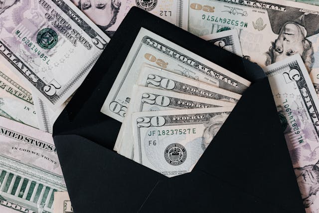 dollar bills in envelope