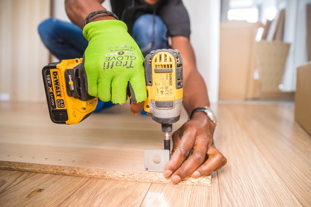 person using power drill