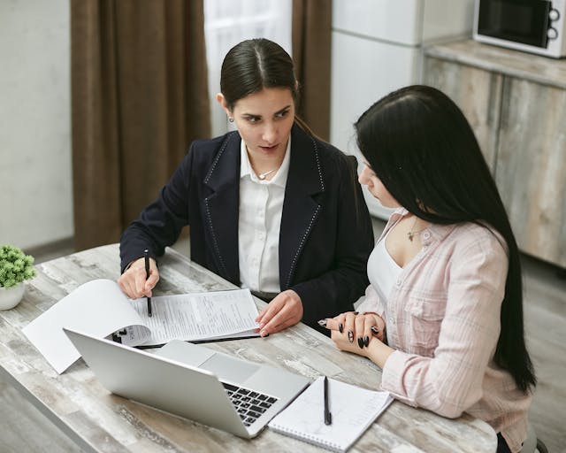 two-people-meeting-indoors-laptop